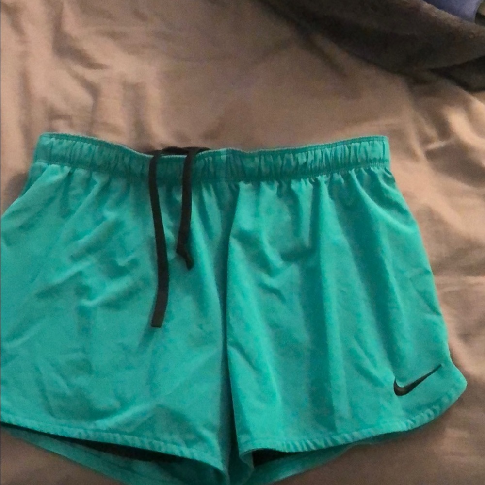 Teal green Nike shorts with built in spandex